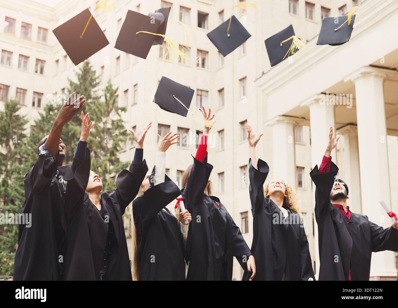 Graduation Ceremony Celebration With a Collage of Graduates Throwing ...