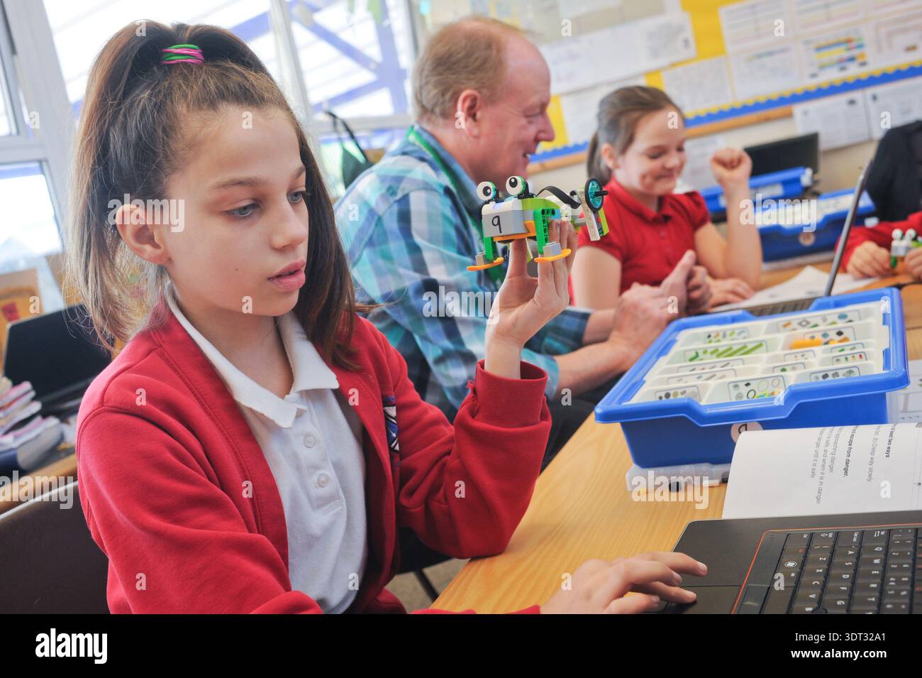 Primary school aged children learning to code and using computers ...