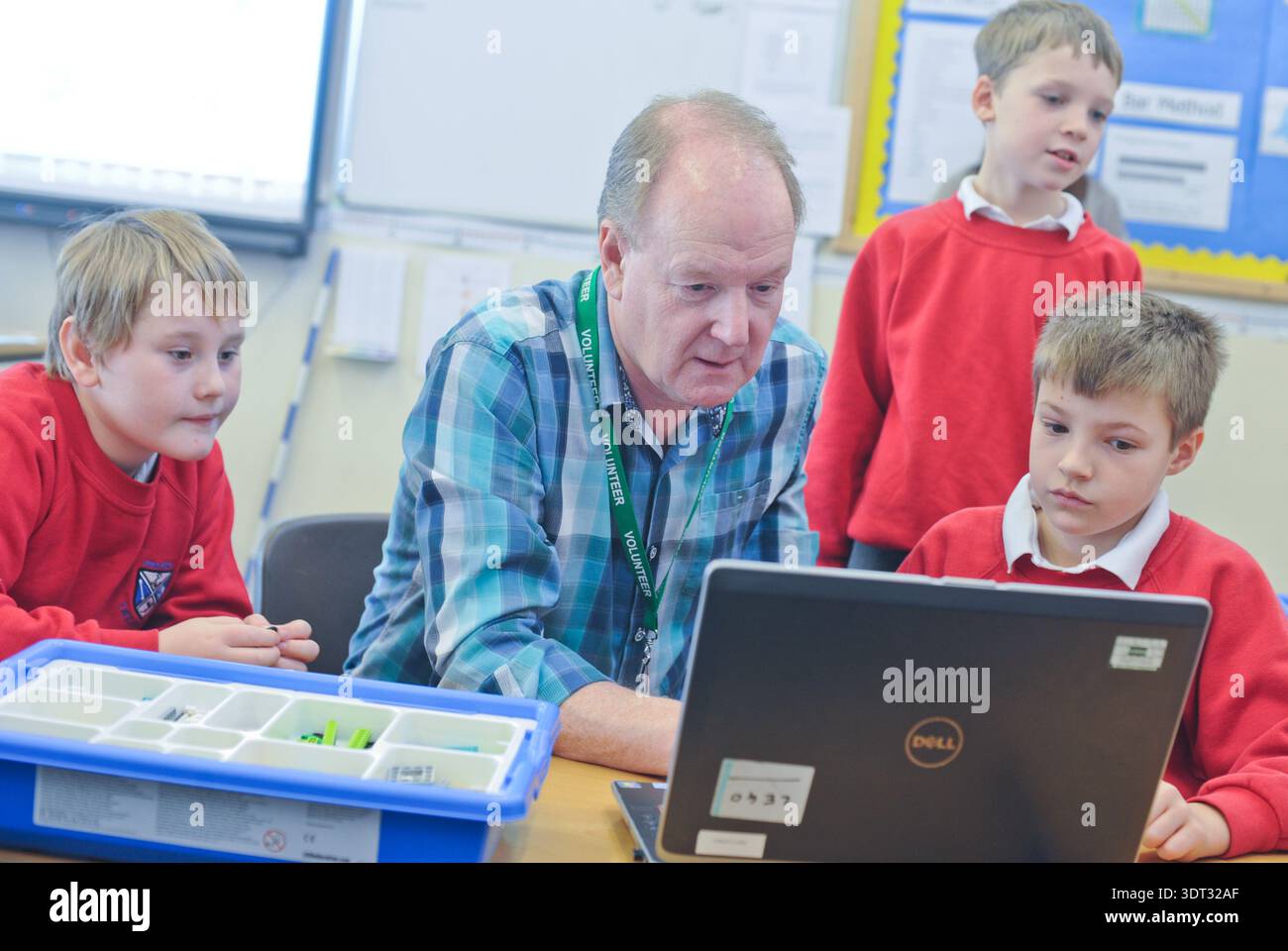 Primary school aged children learning to code and using computers ...