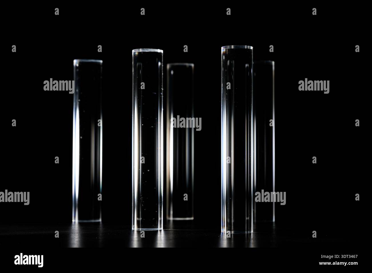 Clear Acyrlic rod against a black background Stock Photo