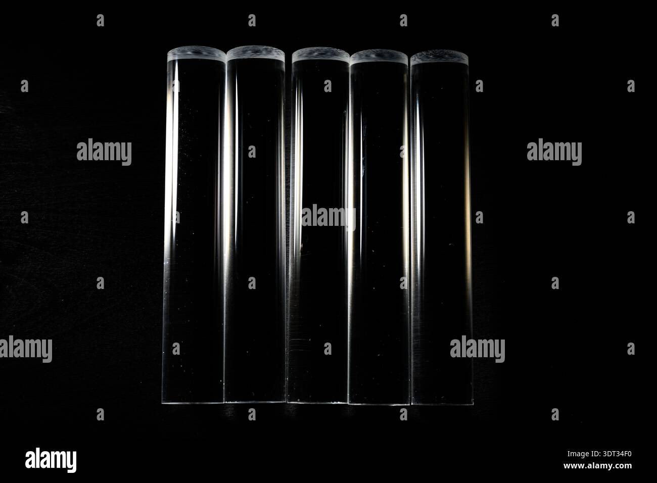 Clear Acyrlic rod against a black background Stock Photo