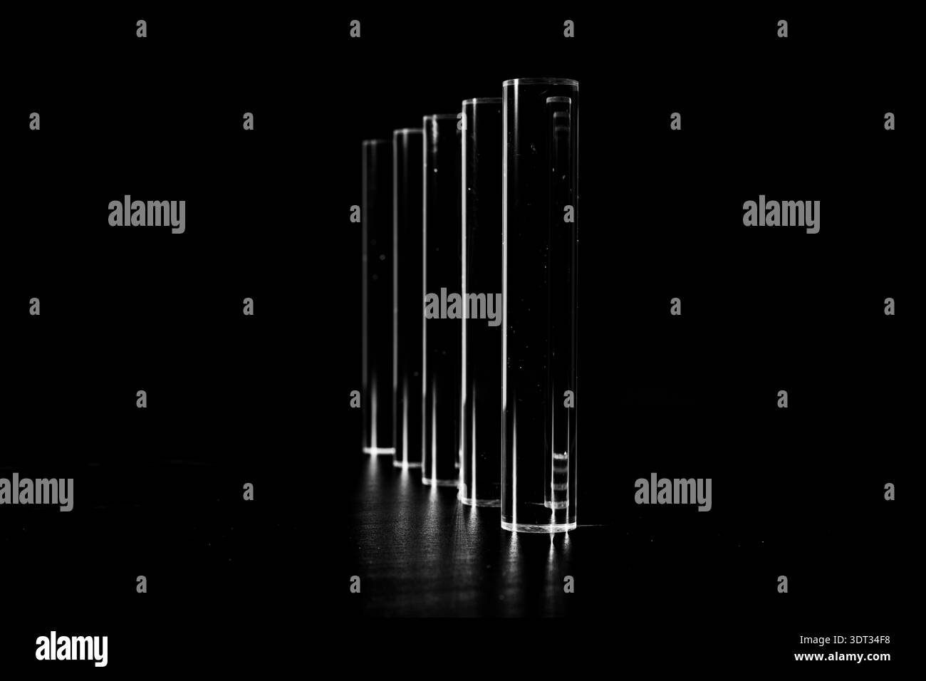 Clear Acyrlic rod against a black background Stock Photo