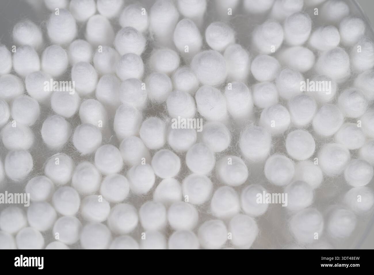 Abstract cotton swabs pattern uniform round tips creating repeating texture, bright white, usable as seamless background or textile print Stock Photo