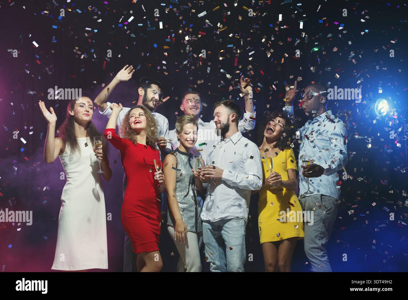 Group of People Celebrating With Confetti During a Festive Event at ...