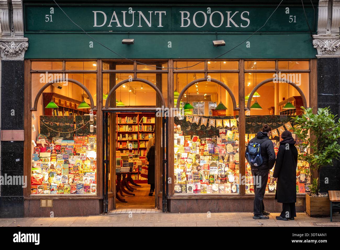 LONDON - DECEMBER 15, 2025: Daunt Books Hampstead bookshop festive storefront South End Road Christmas display Stock Photo