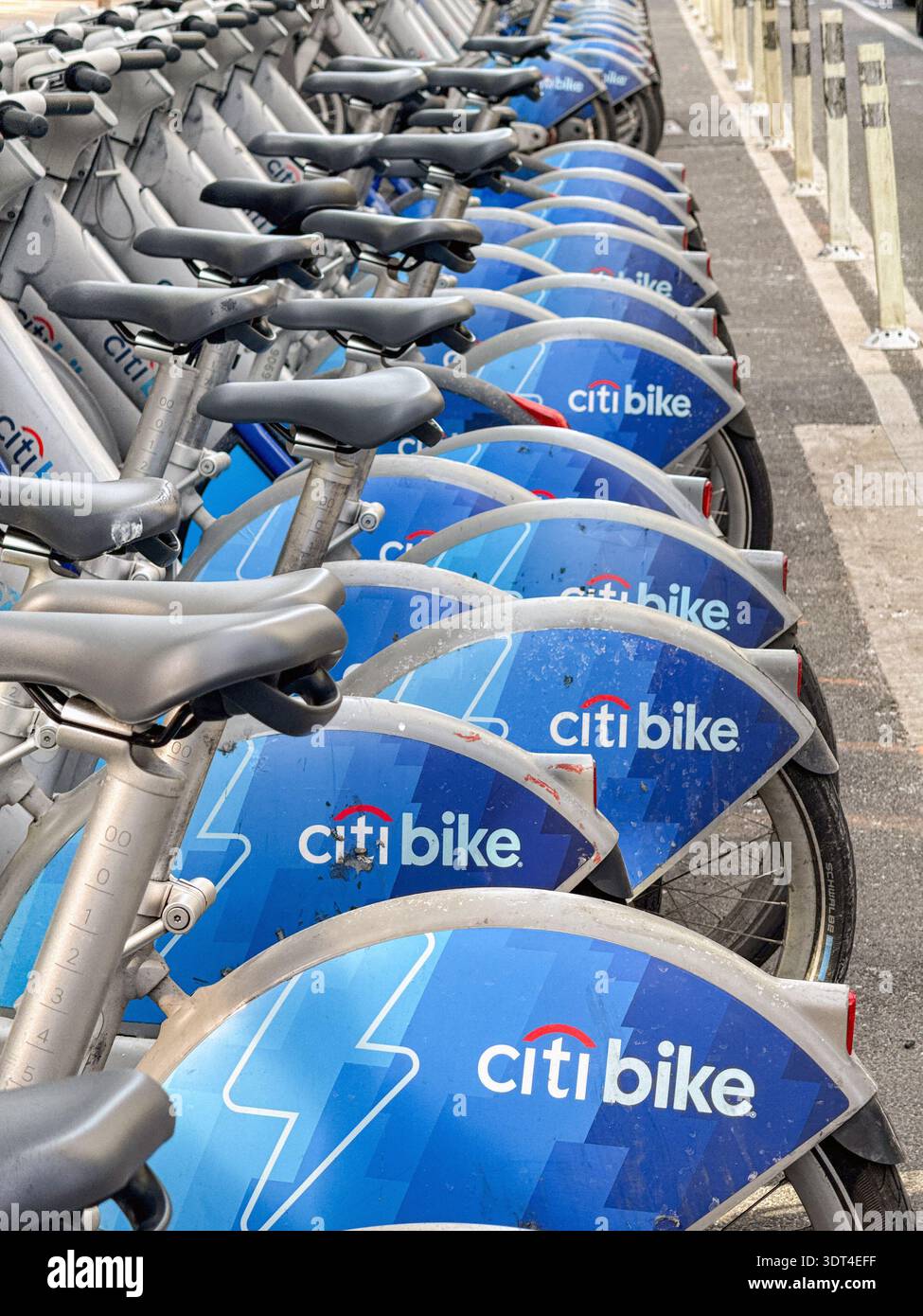 New York, USA - 23 January 2026:  Row of bicycles sponsored by Cit Bike in their parking stations in Manhattan. The bikes can be rented - Smartphone Captured Stock Image