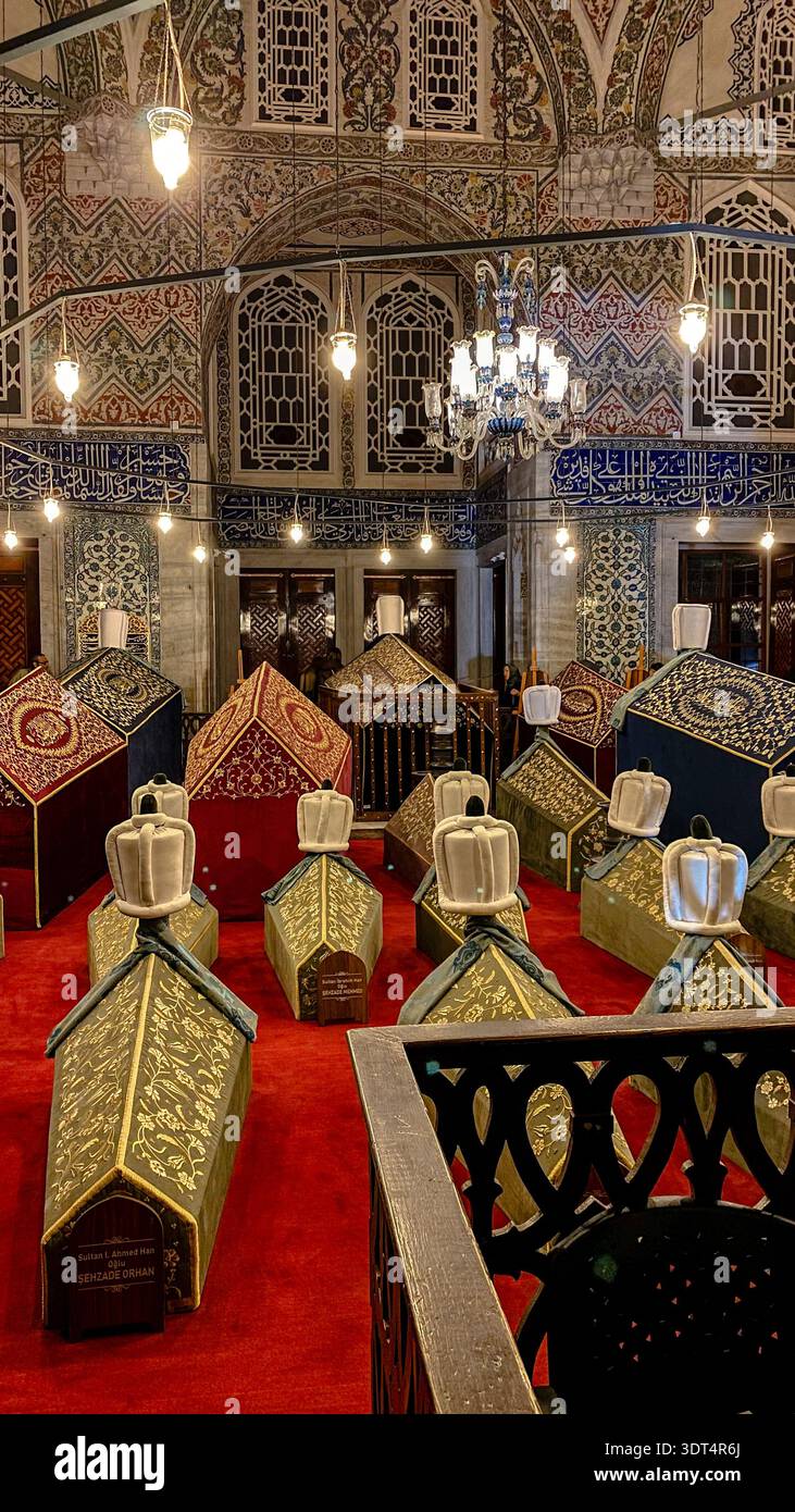 Royal cenotaphs covered with embroidered textiles inside the Tomb of Sultan Ahmed I beside the Blue Mosque in Istanbul, Turkey. Stock Photo