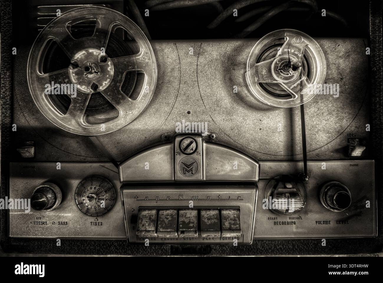 Vintage reel‑to‑reel tape recorder with dual reels and analog controls, mid‑20th‑century home audio equipment - Smartphone Captured Stock Image