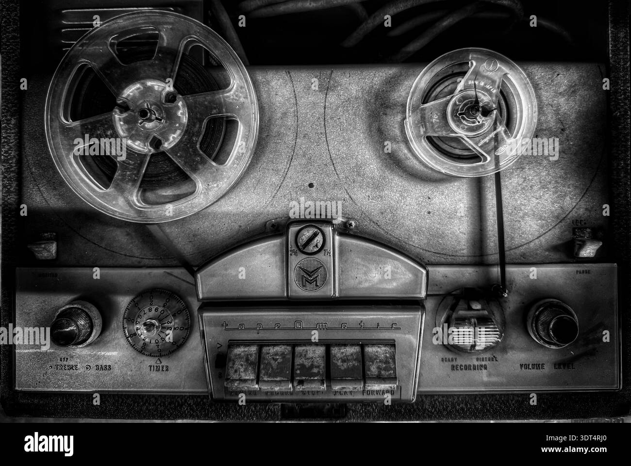 Vintage reel‑to‑reel tape recorder with dual reels and analog controls, mid‑20th‑century home audio equipment - Smartphone Captured Stock Image