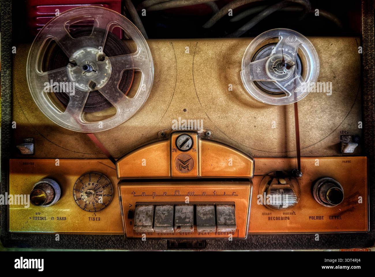 Vintage reel‑to‑reel tape recorder with dual reels and analog controls, mid‑20th‑century home audio equipment - Smartphone Captured Stock Image