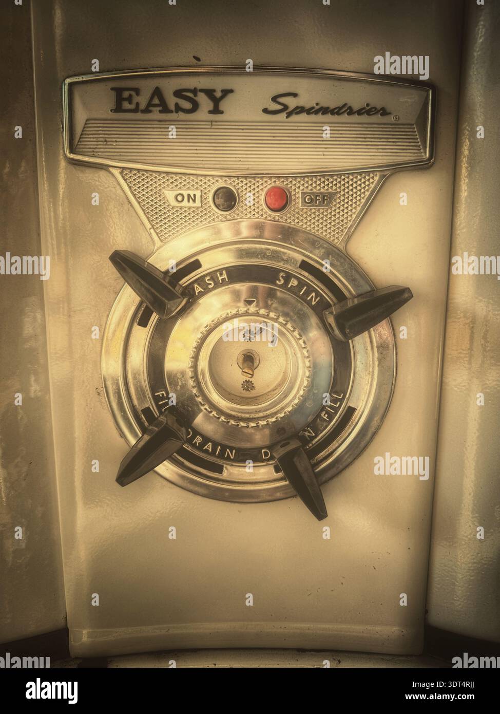 Close‑up view of the control panel on an Easy Spindrier vintage washing machine, showing rotary wash and spin controls with on/off buttons on a mid‑20 - Smartphone Captured Stock Image