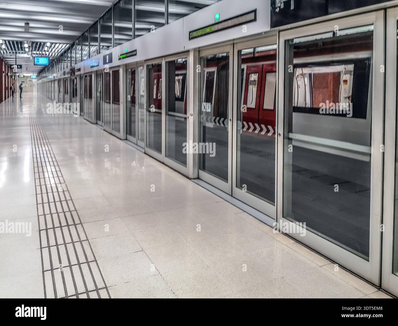 Barcelona, Spain - November 26, 2021: The train arrived at the Zona Universitaria Metro station in Barcelona. Modern minimalist metro station interior - Smartphone Captured Stock Image