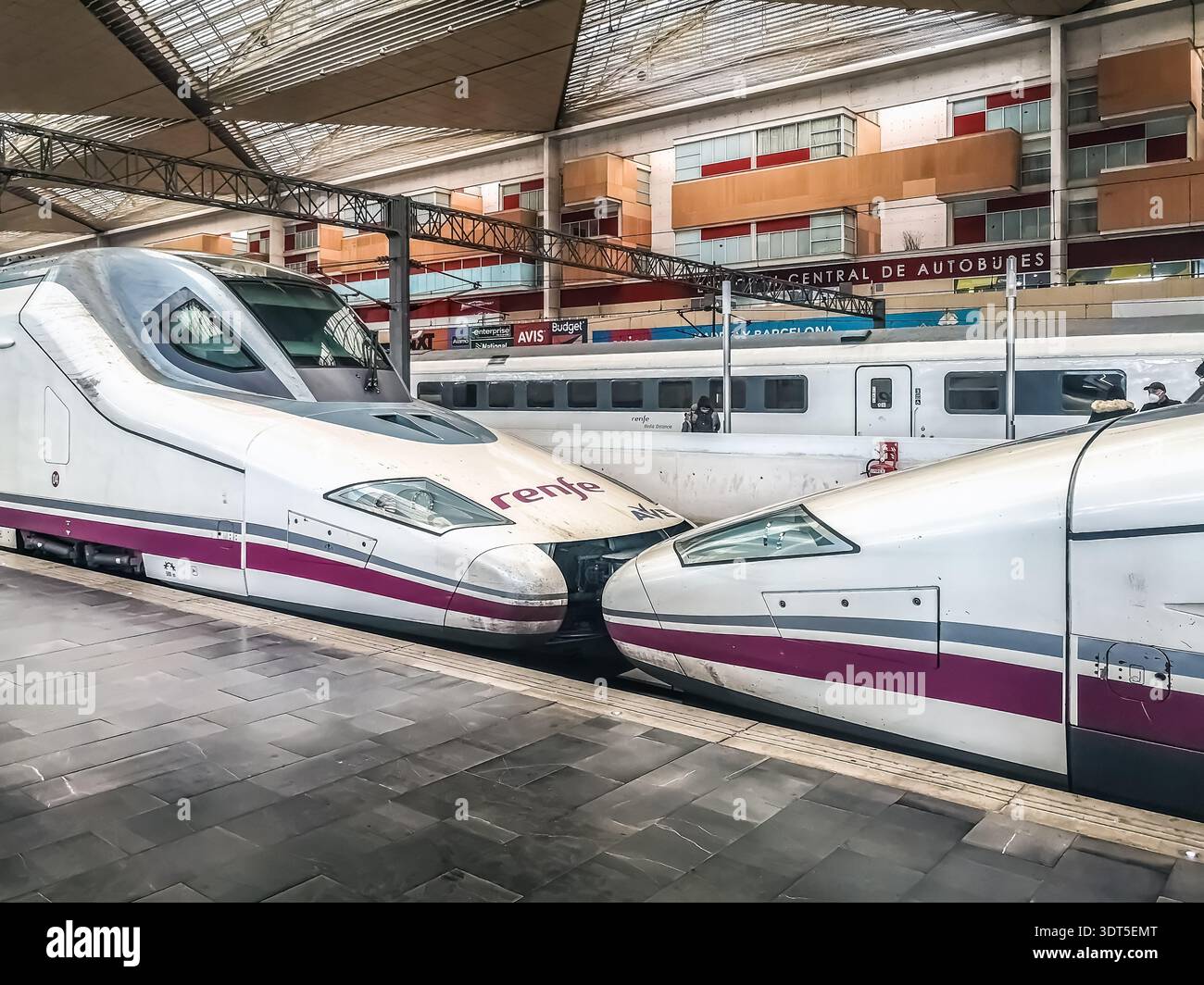 High-speed Renfe AVE trains at the Zaragoza-Delicias railway station. Modern architecture of the transport hub. Zaragoza, Spain - November 29, 2021 - Smartphone Captured Stock Image