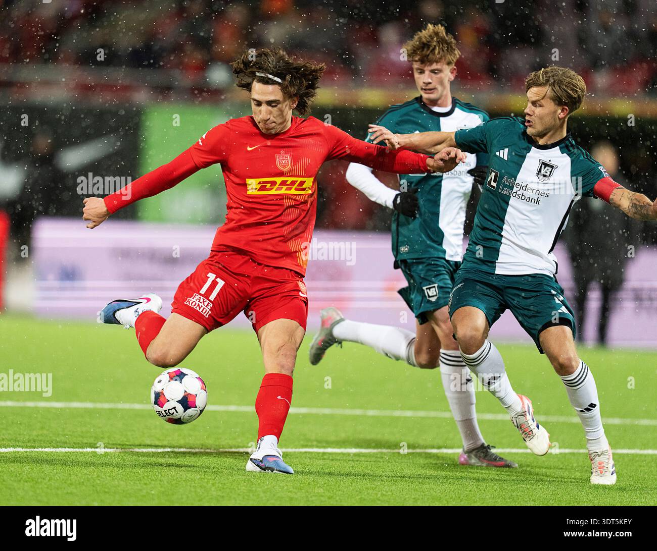 FC Nordsjaelland's Alexander Lind and Vejle's Thomas Gundelund during ...