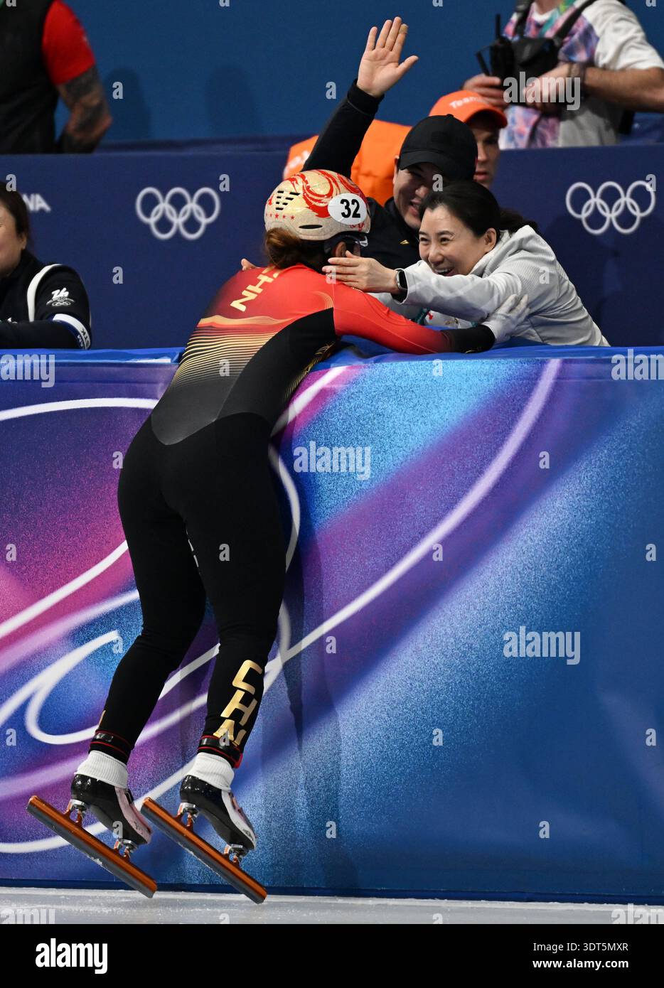 Jing Ru Yang Milan, Italy. 20th Feb, 2026. Yang Jingru (L) of China celebrates with ...