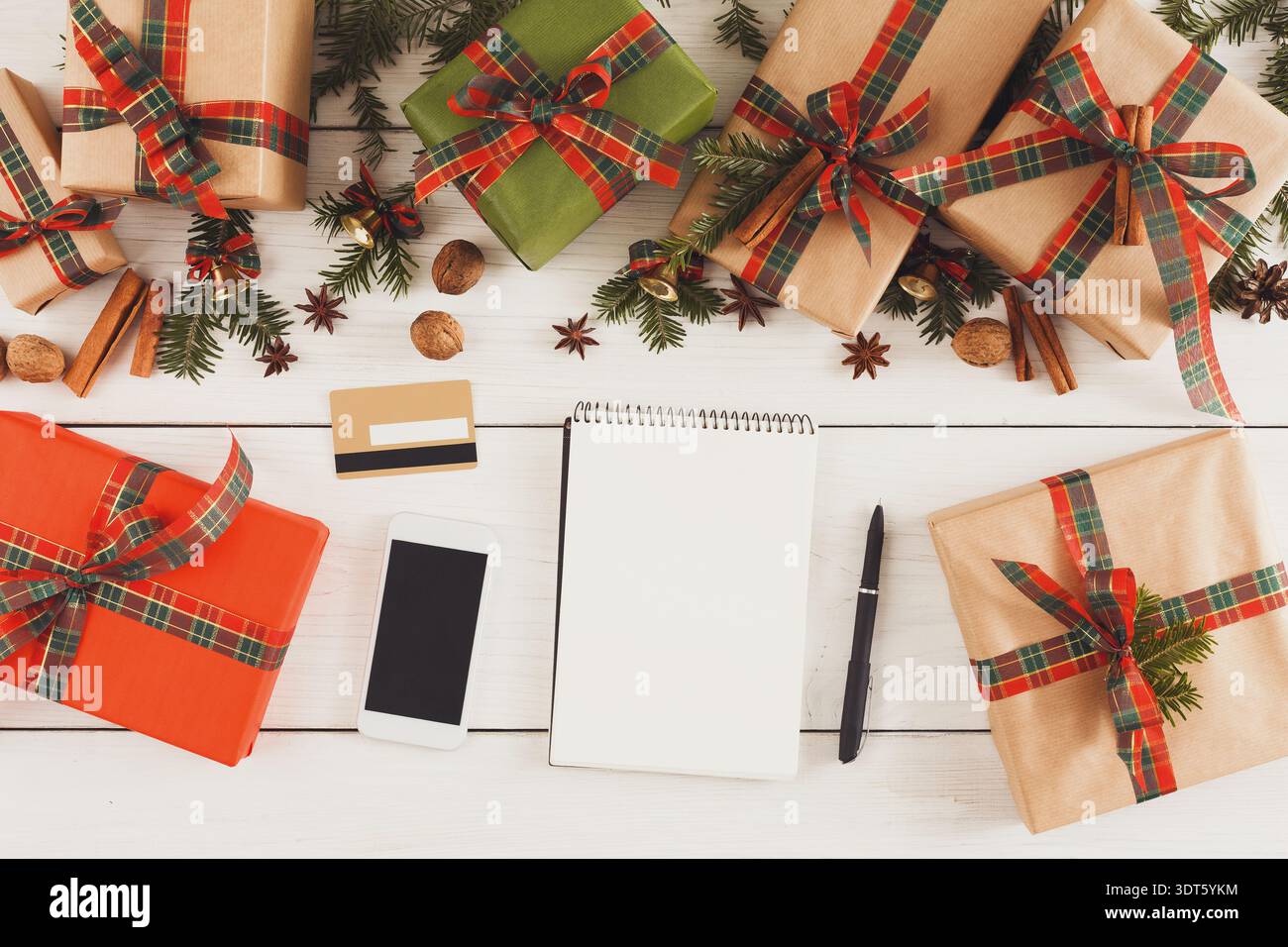 Gift Boxes and Stationery for Holiday Planning on a Wooden Table Stock Photo