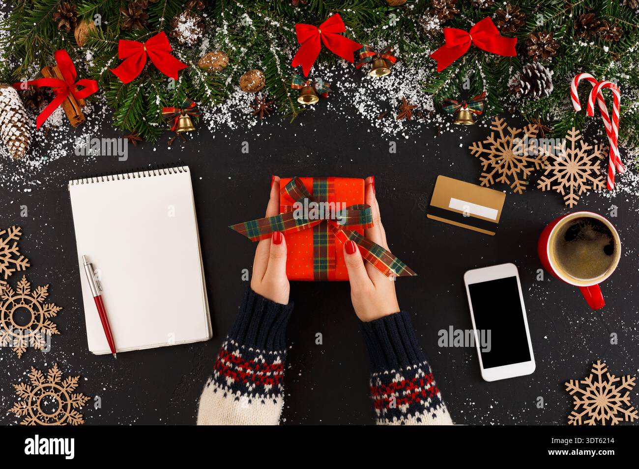 Gift Wrapping Session With Decorations and Holiday Items on a Table Top Stock Photo
