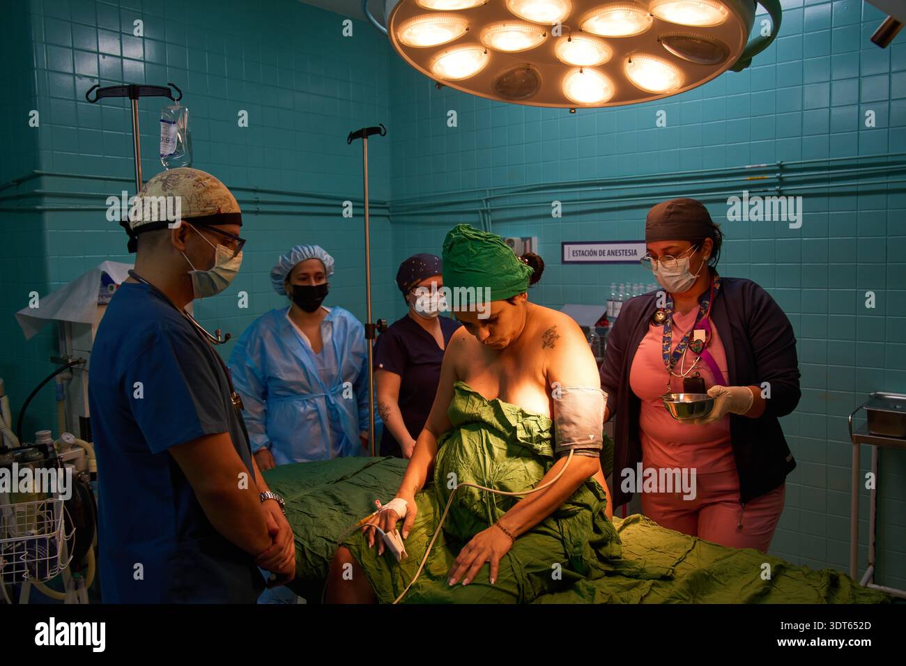 Daimara de la Fe Viera sits in an operating room before her cesarean ...