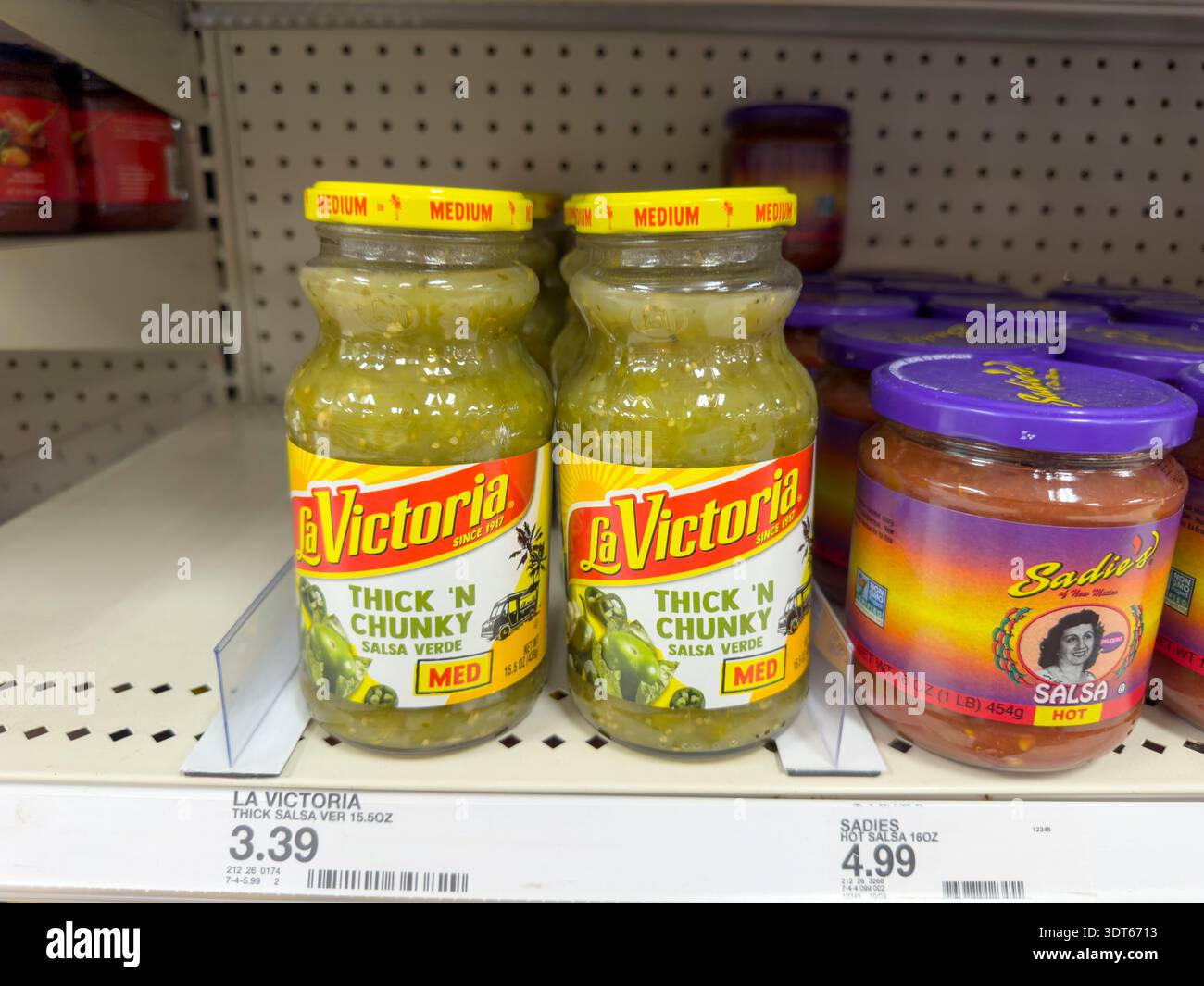 Los Angeles, California, United States - 08-14-2024: A view of several jars of La Victoria salsa, at the store. Stock Photo