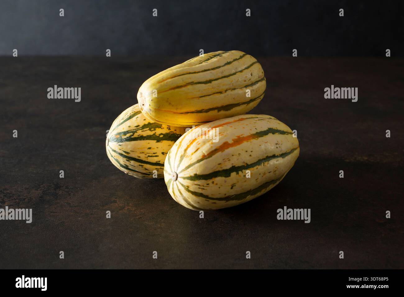 A view of a stack of delicata squash. Stock Photo