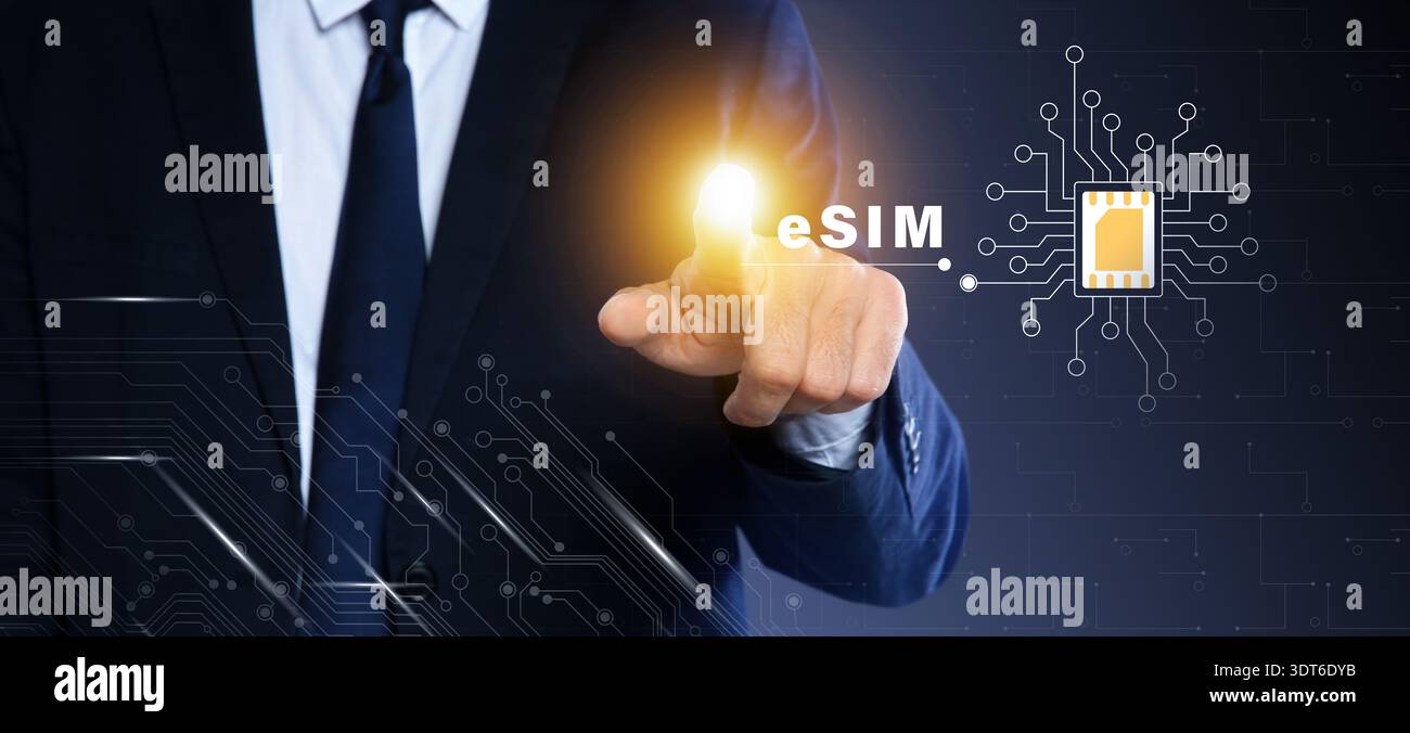 Businessman activating eSIM microchip on virtual screen, closeup. Dark background Stock Photo
