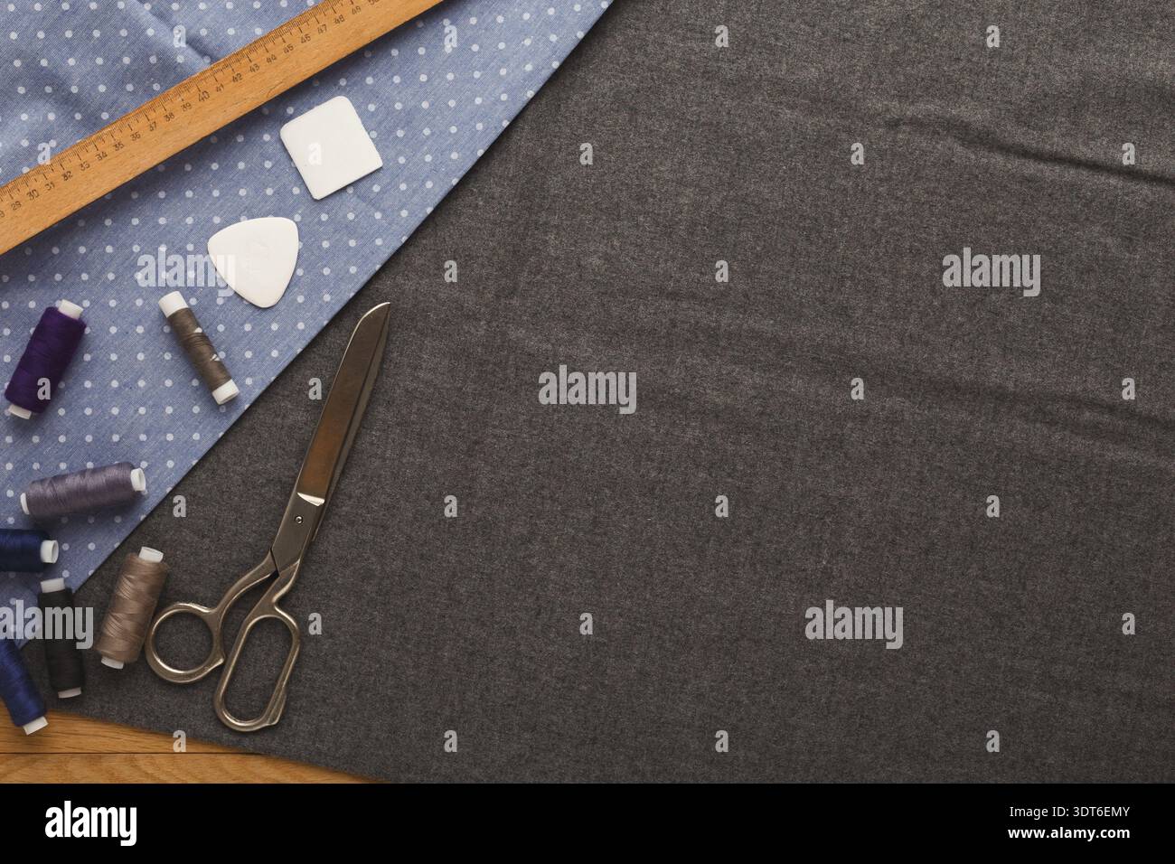 Crafting Projects Using Fabric, Scissors, Thread, and Tools in a Creative Workspace Setup Stock Photo