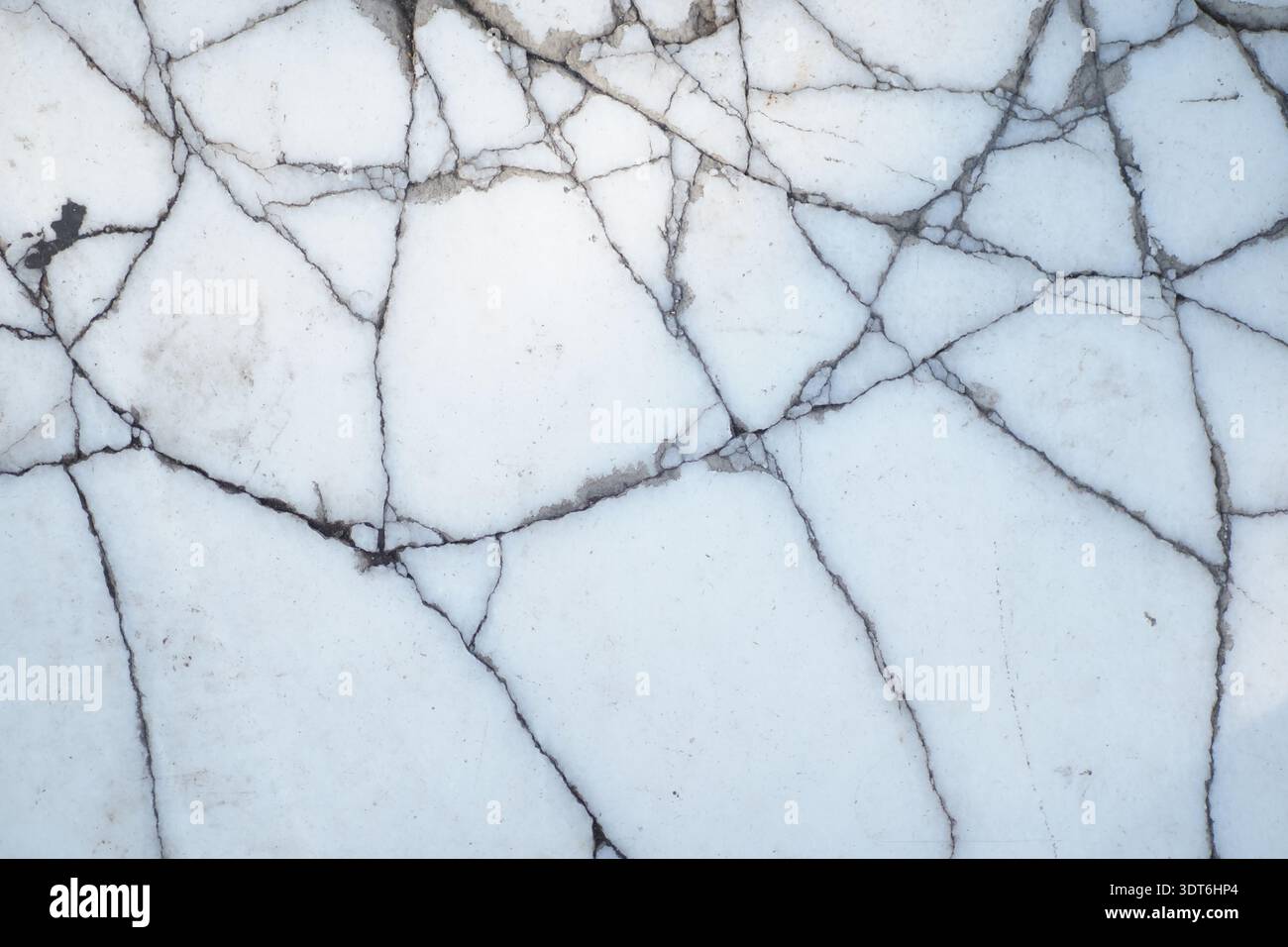 White marble surface with black veins and cracks Stock Photo