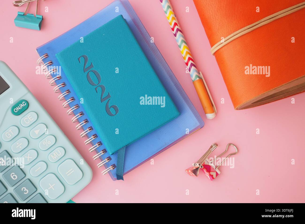New planner and study tools arranged on a pink surface Stock Photo