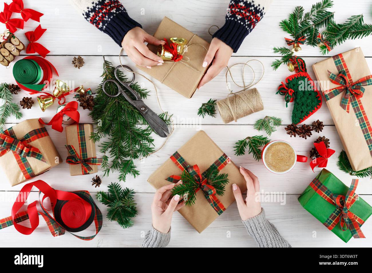 Gift Wrapping Session During Holiday Preparation With Various Materials and Decorations Stock Photo
