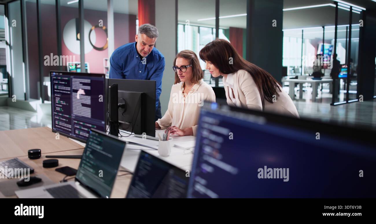 Dedicated Team Of Programmers Collaborates On New Website Design Project Stock Photo