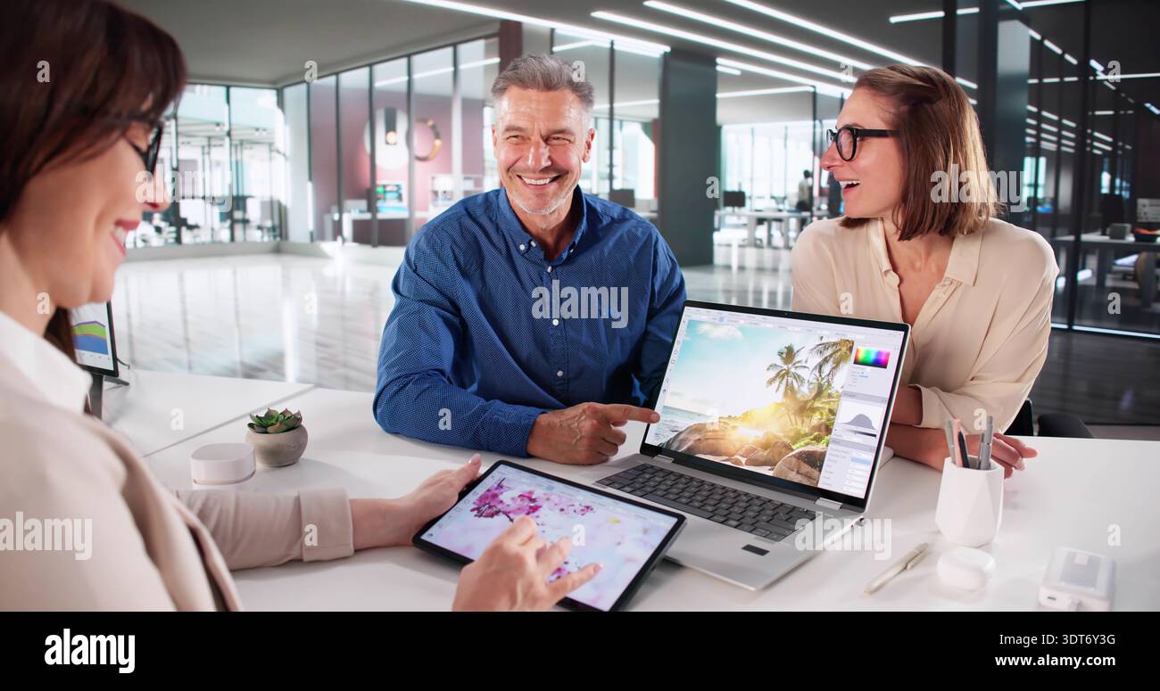 Creative Artist And Photographer Using Computer For Graphic Design Work Stock Photo