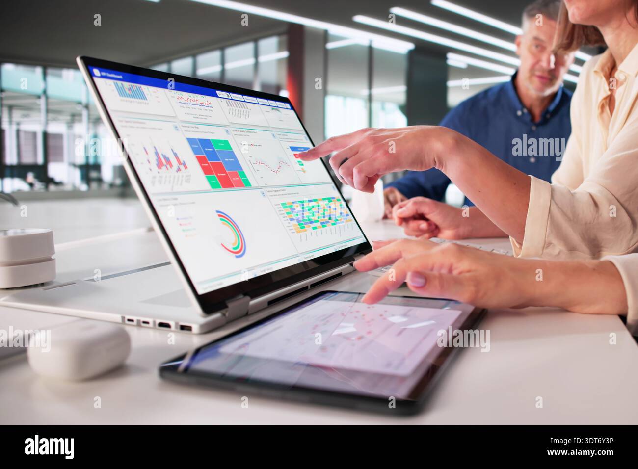 Analytic Data Display On Tablet In Digital Business Team Meeting Stock Photo