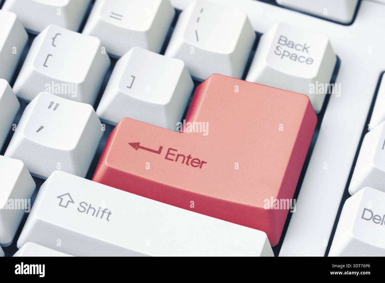 Keyboard with red Enter key. Close up view Stock Photo