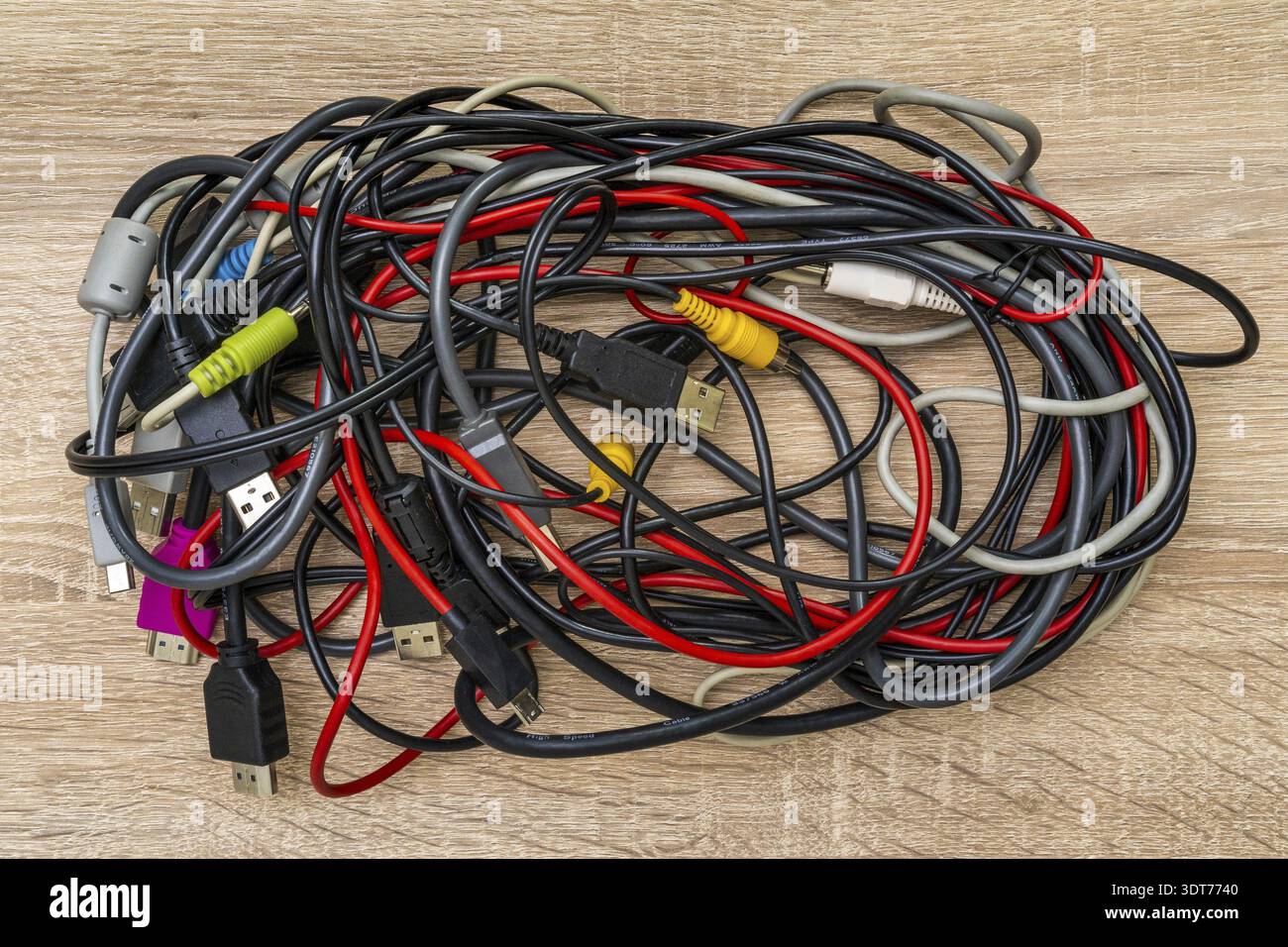 Bundle of various cables with various connectors suitable for different ports. Concept of great number of pc peripherals, equipments and connected dev Stock Photo