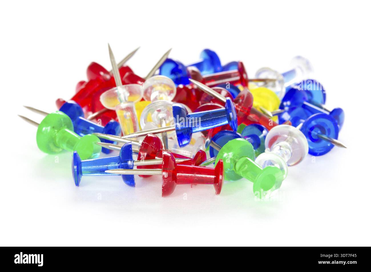 Pile of colorful pushpins on a white background Stock Photo