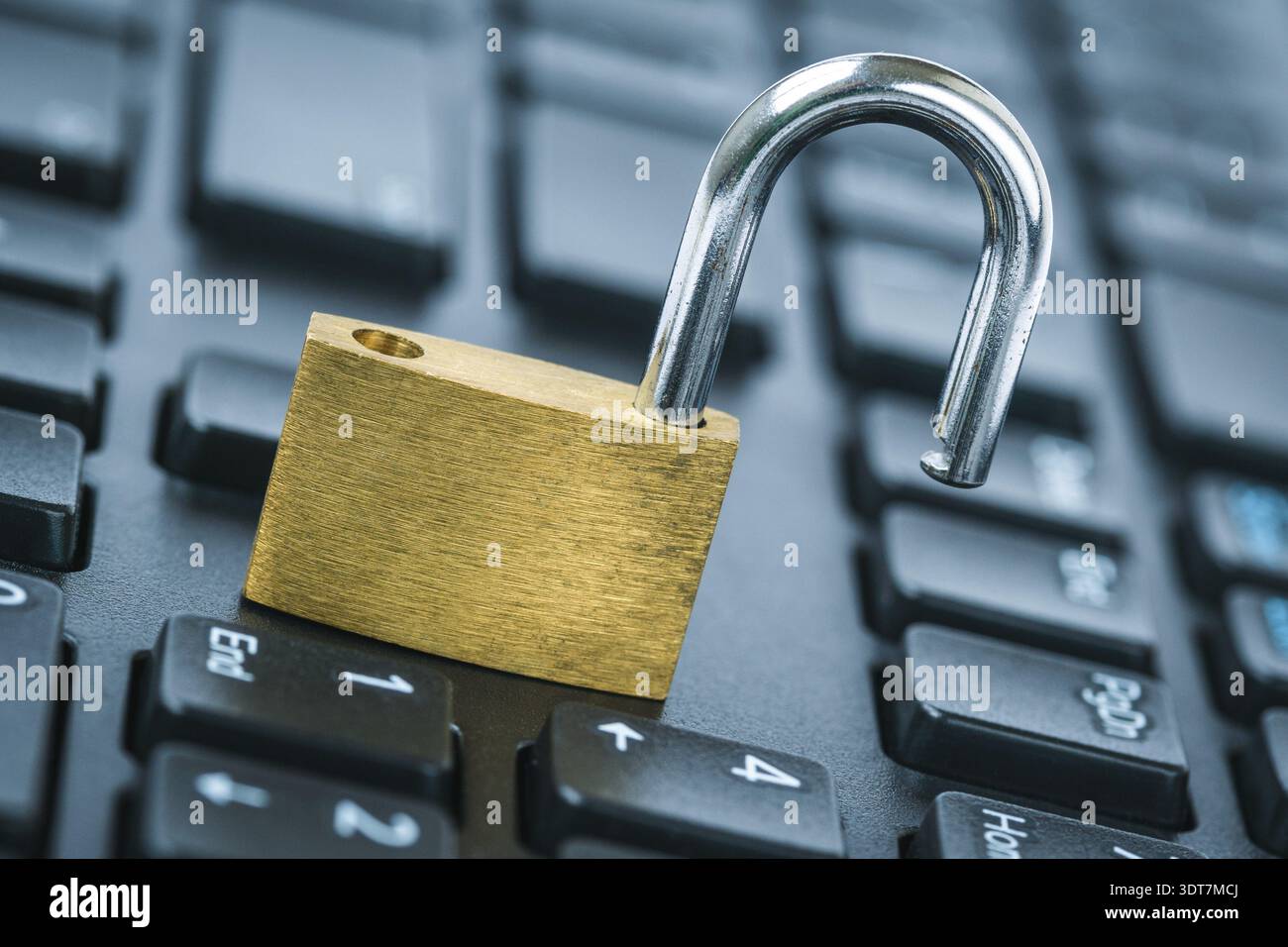 Computer security concept. Unlocked padlock on laptop keyboard. Open security lock on computer keyboard - computer security breach concept Stock Photo