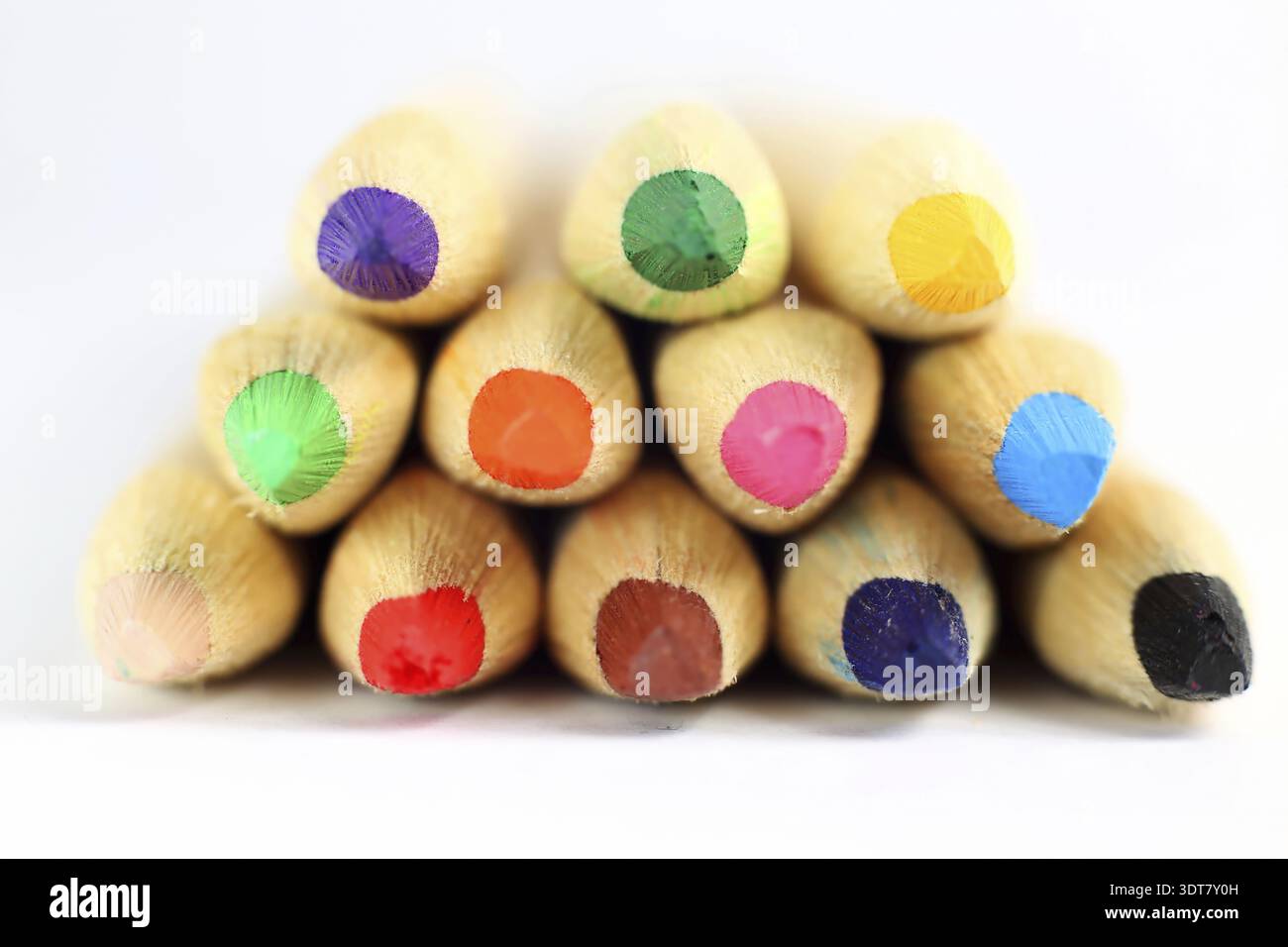 Vividly arranged colorful pencils on a surface Stock Photo