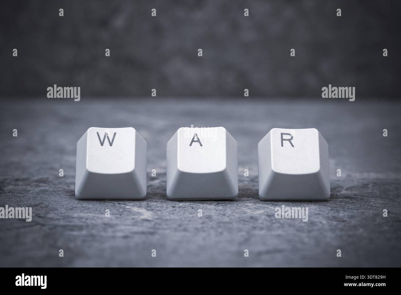 Computer keyboard keys arranged to spell WAR word. Cyberwar concept Stock Photo