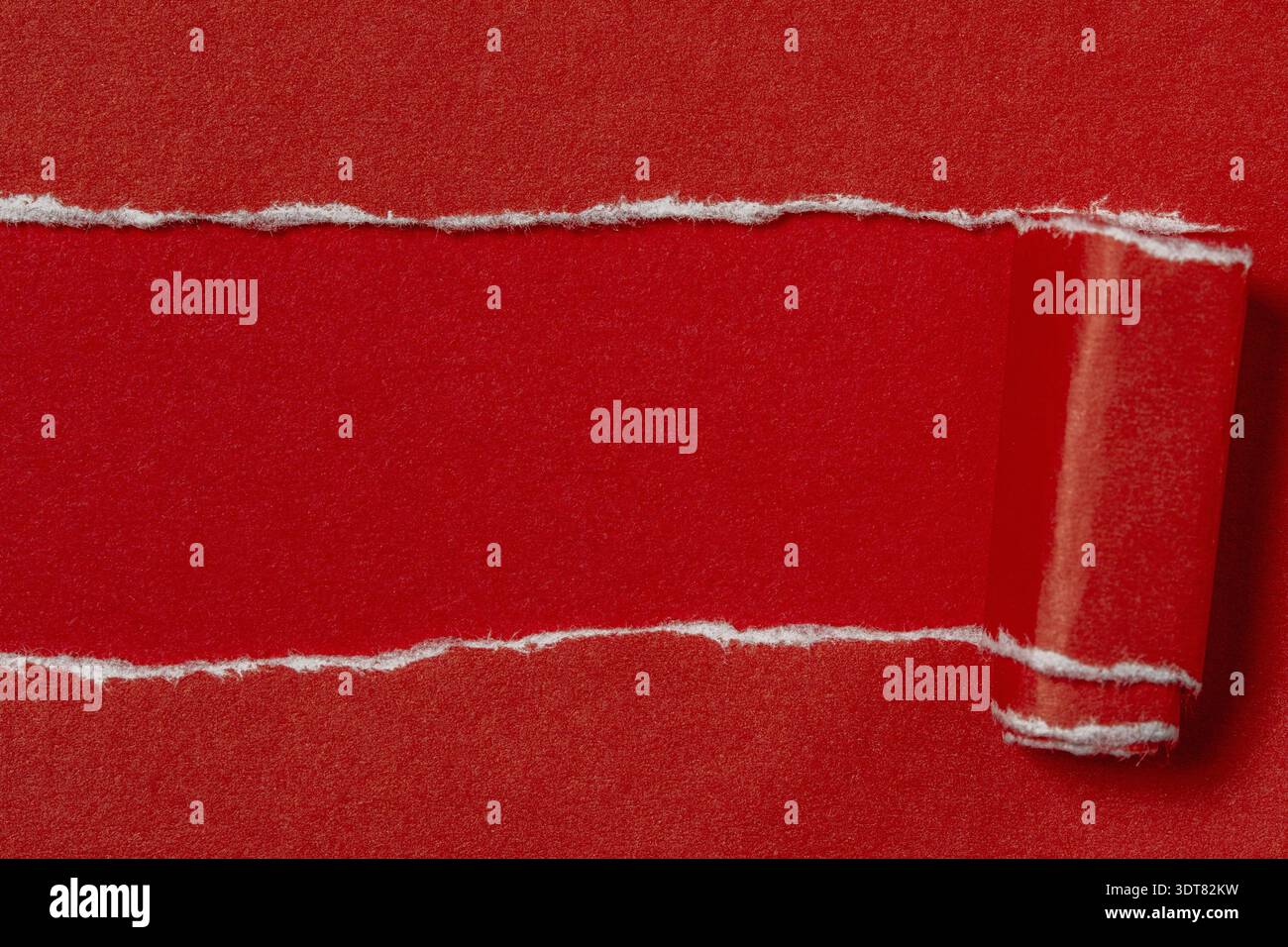 Torn red paper with red background. Space for text Stock Photo
