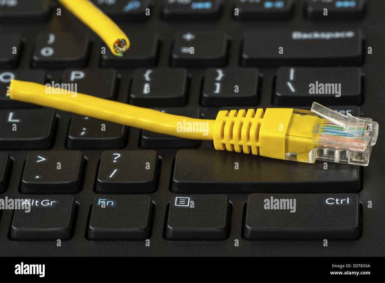 Internet connection disconnected, yellow network cable cutted off Stock Photo