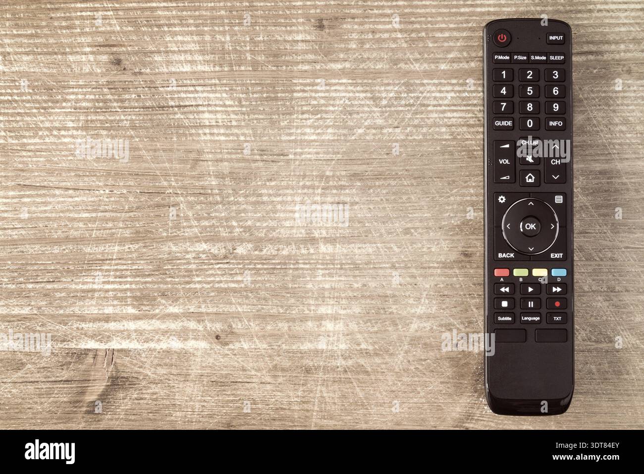 Tv remote controller on wooden background, copy-space Stock Photo
