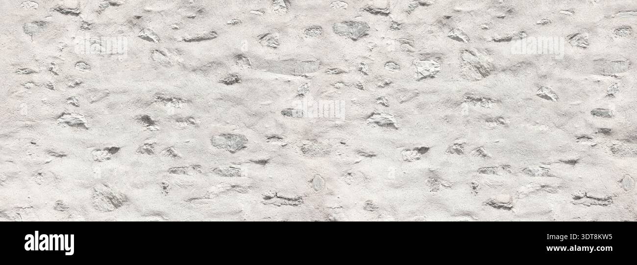 White painted stone wall showing old masonry and rugged surface texture Stock Photo