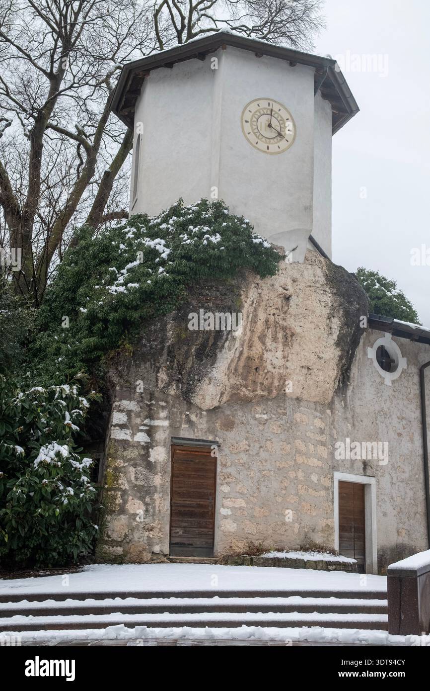 Mountain church on a snowy mountain. The image is part of a series taken in Trentino, Northern Italy, during a snowy day Stock Photo