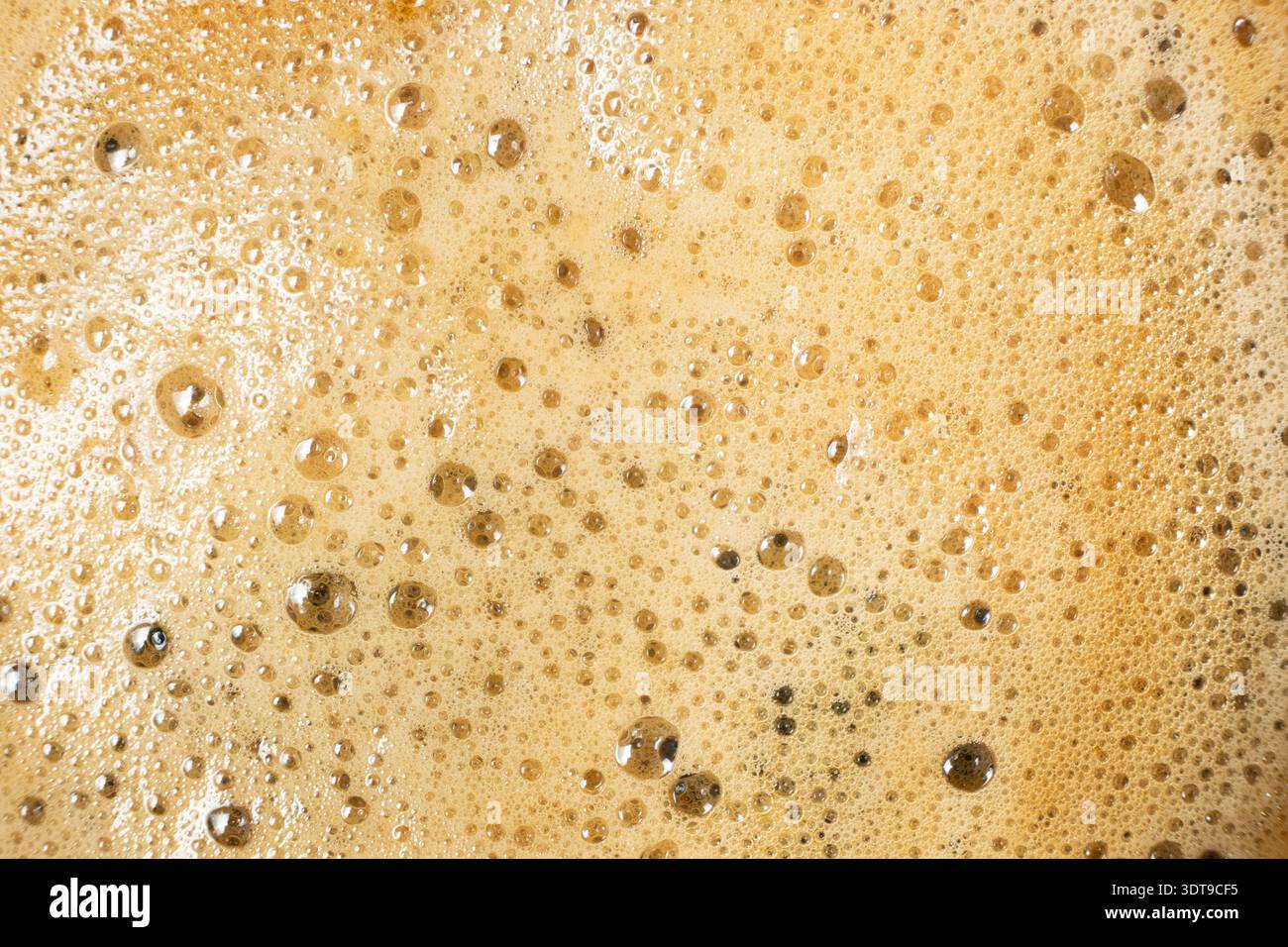 Brown and gold coffee bubbles texture for culinary background Stock Photo