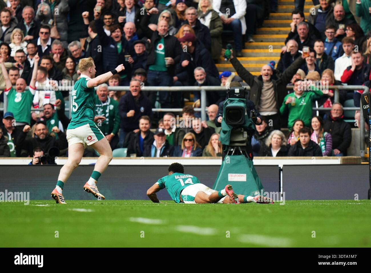 Ireland's Jamie Osborne, left, celebrates as teammate Rob Baloucoune ...