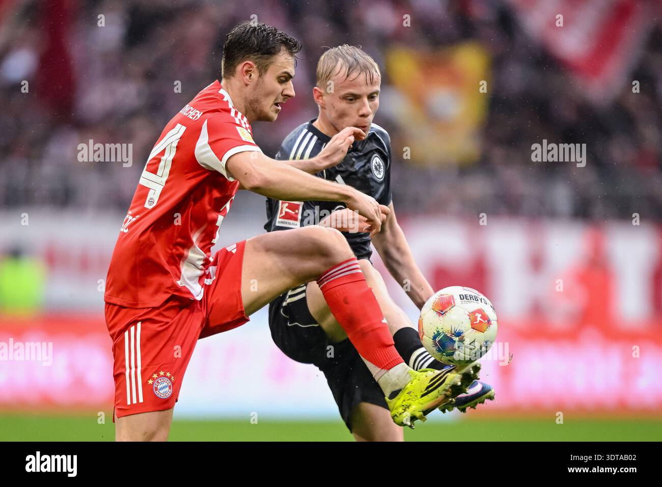 Bayern Munich's Josip Stanisic, left, and Frankfurt's Oscar Höjlund in ...