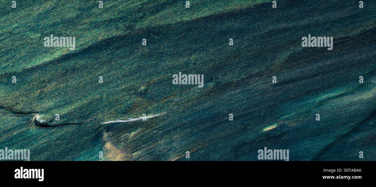 Abstract dark teal and green textured surface with diagonal brushstroke pattern Stock Photo