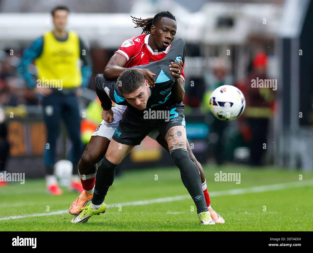 Ipswich Town's Leif Davis is fouled by Wrexham's Issa Kabore (top ...
