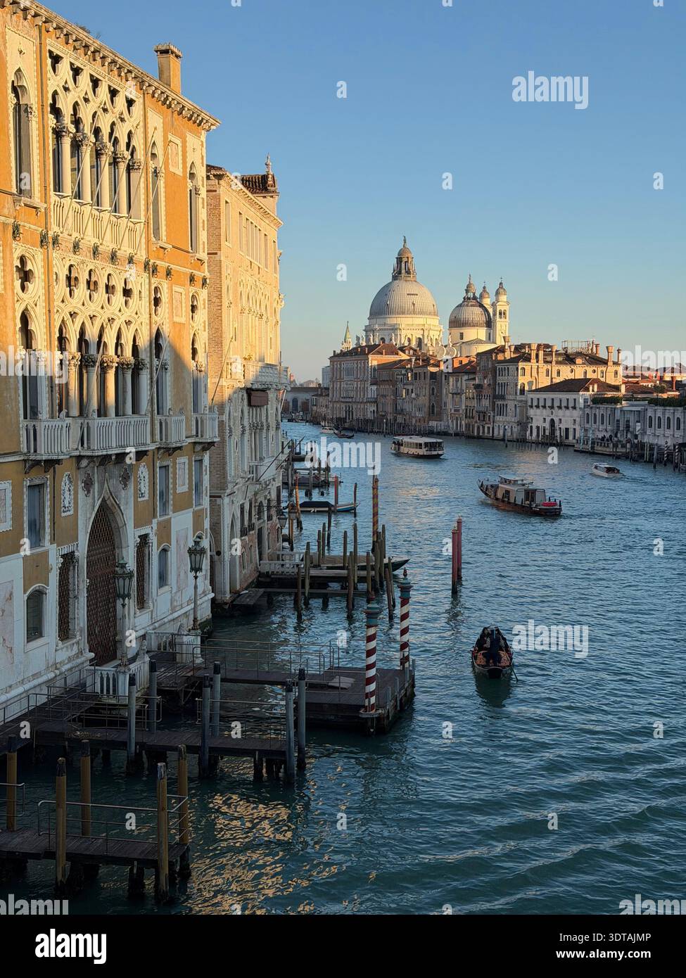 Grand Canal with gondola and Basilica di Santa Maria della Salute at ...