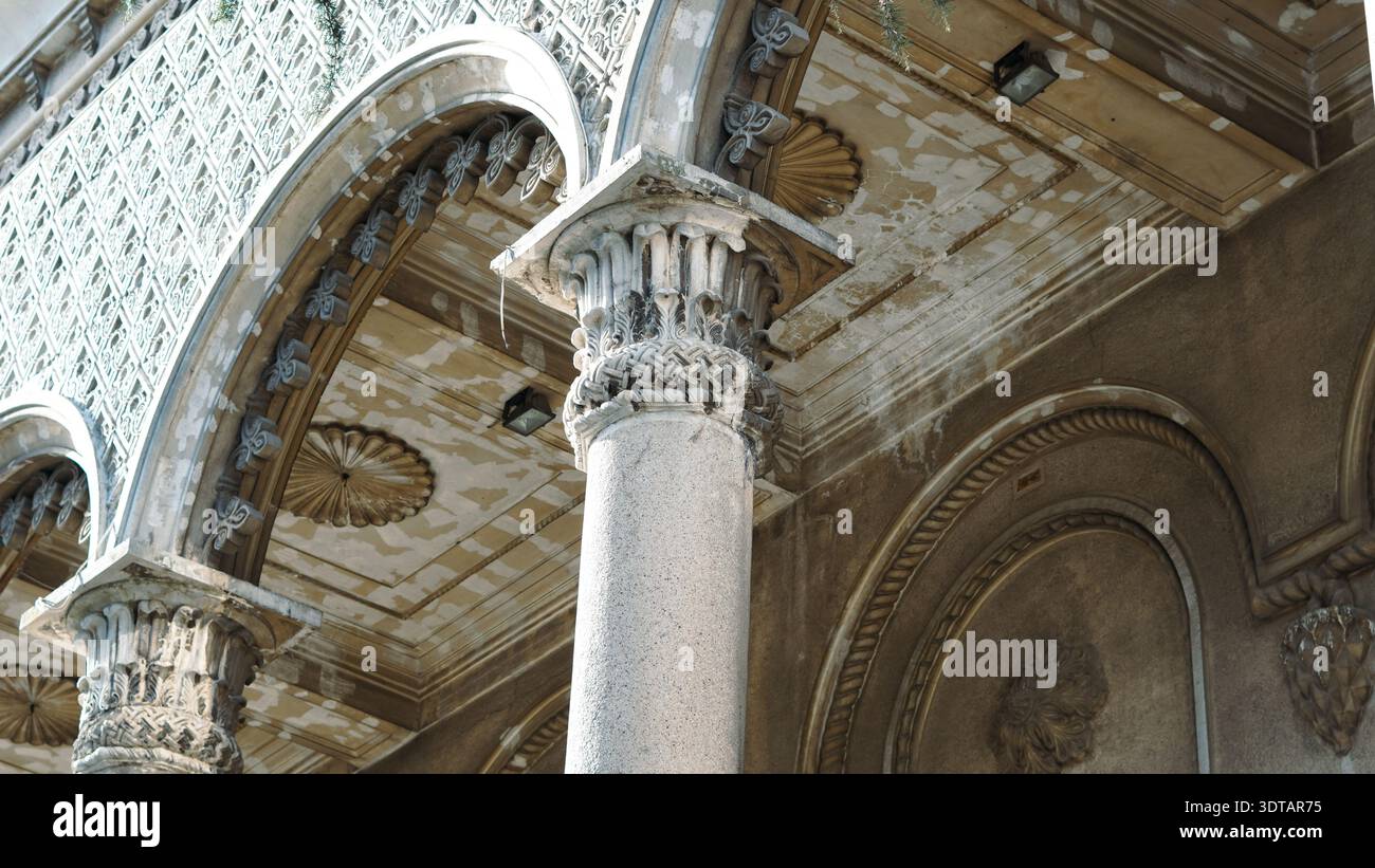 Close-up view of classical columns and intricate ceiling design in a ...